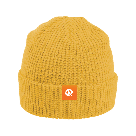 Yellow knit beanie with an orange QUIETER logo on a white background