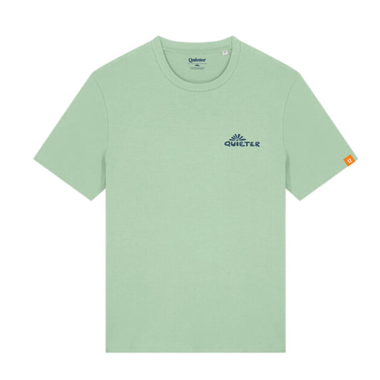 A light sage green short-sleeve t-shirt with a small navy blue Quieter logo on the left chest and a small orange tag on the right sleeve, shown on a plain white background.